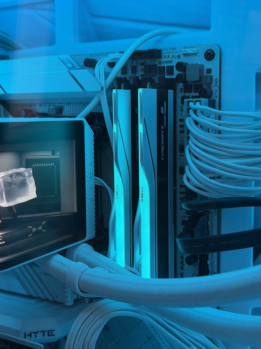 G.Skill Trident Z5 Neo RGB DDR5 32GB installed in white AM5 build showing matte white heatspreaders